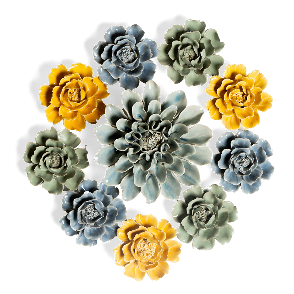 An arrangement of colorful ceramic succulents, featuring blue, green, and yellow hues, centered around a large, detailed flower with layered petals.