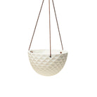 A modern, white, geometric-patterned Mini Mofo Porcelain Modern Hanging planter suspended by three brown leather straps against a plain white background from Chive Studio 2024.