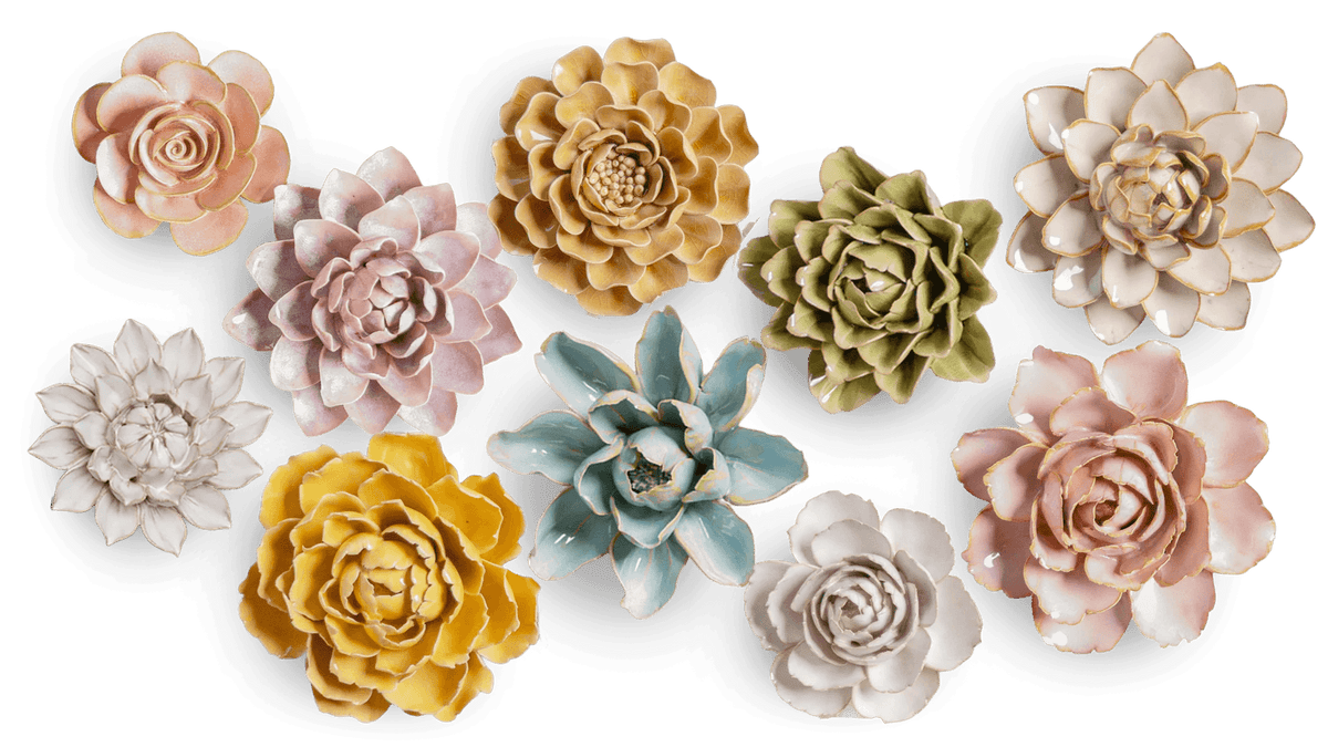 Laying out ceramic flowers before hanging to determine placement on wall