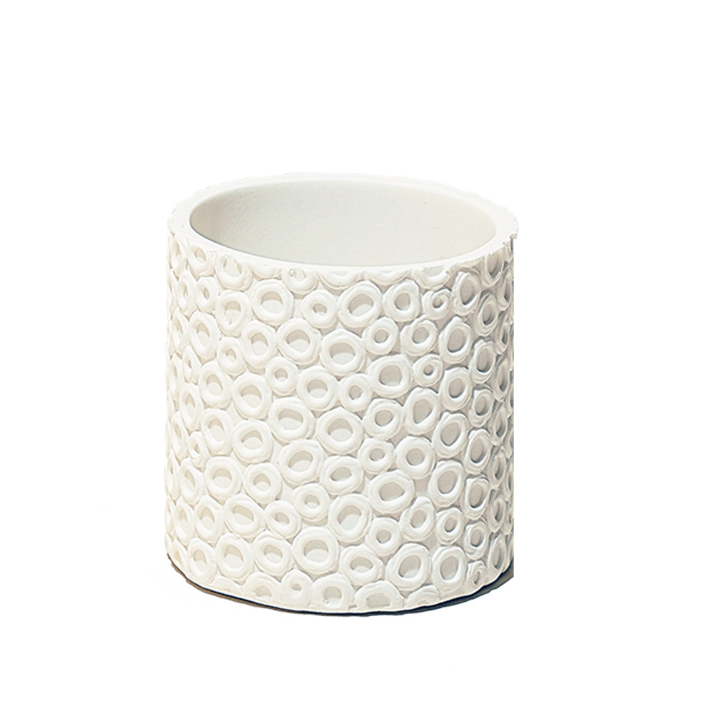A ceramic white planter with a textured exterior design featuring numerous small, raised circles, set against a plain white Chive Studio 2024 Resin Planter Pot background.