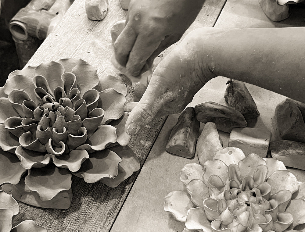 Chive Studio artisan shaping a ceramic flower by hand — designed in Toronto by Chive Studio