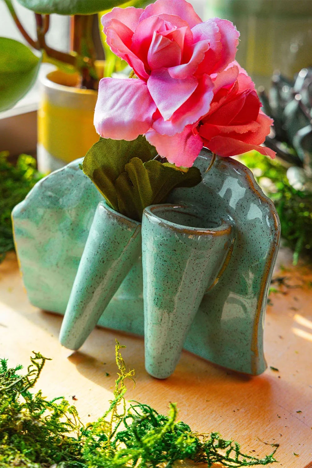 Lotus green ceramic bud vase with a single stem — designed in Toronto by Chive Studio